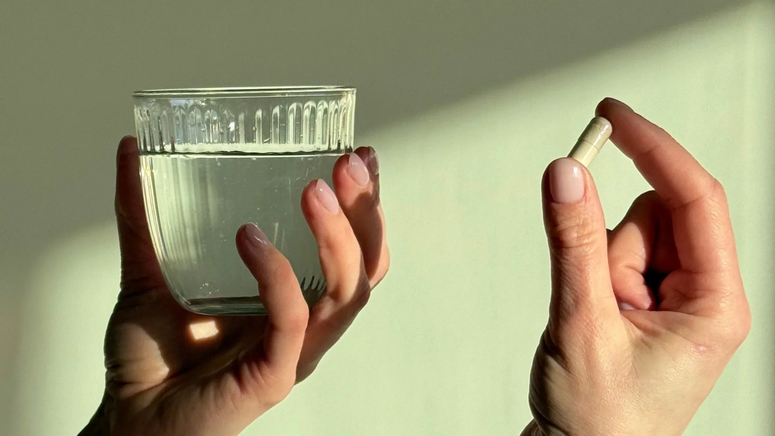 A supplement and a glass of water